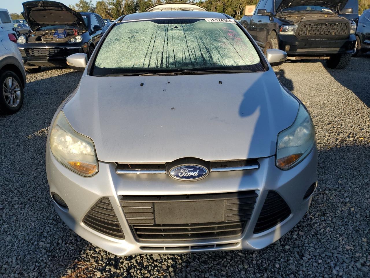 2014 Ford Focus VIN 1FADP3F23EL142197 Copart auction photo, water/flood damage thumbnail 5