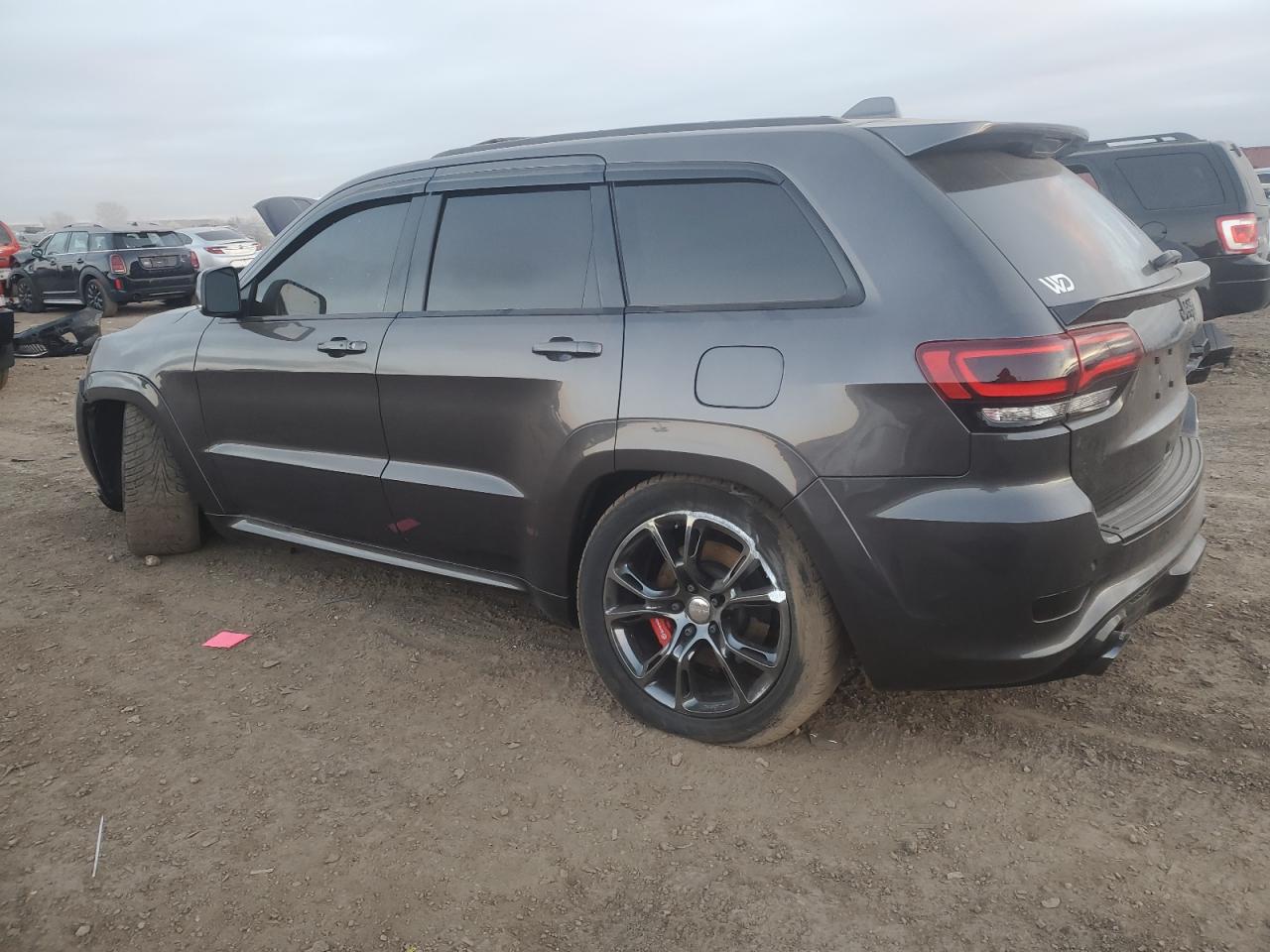 2015 Jeep Grand Cherokee VIN 1C4RJFDJ3FC724847 Copart auction photo, front end / side damage thumbnail 2