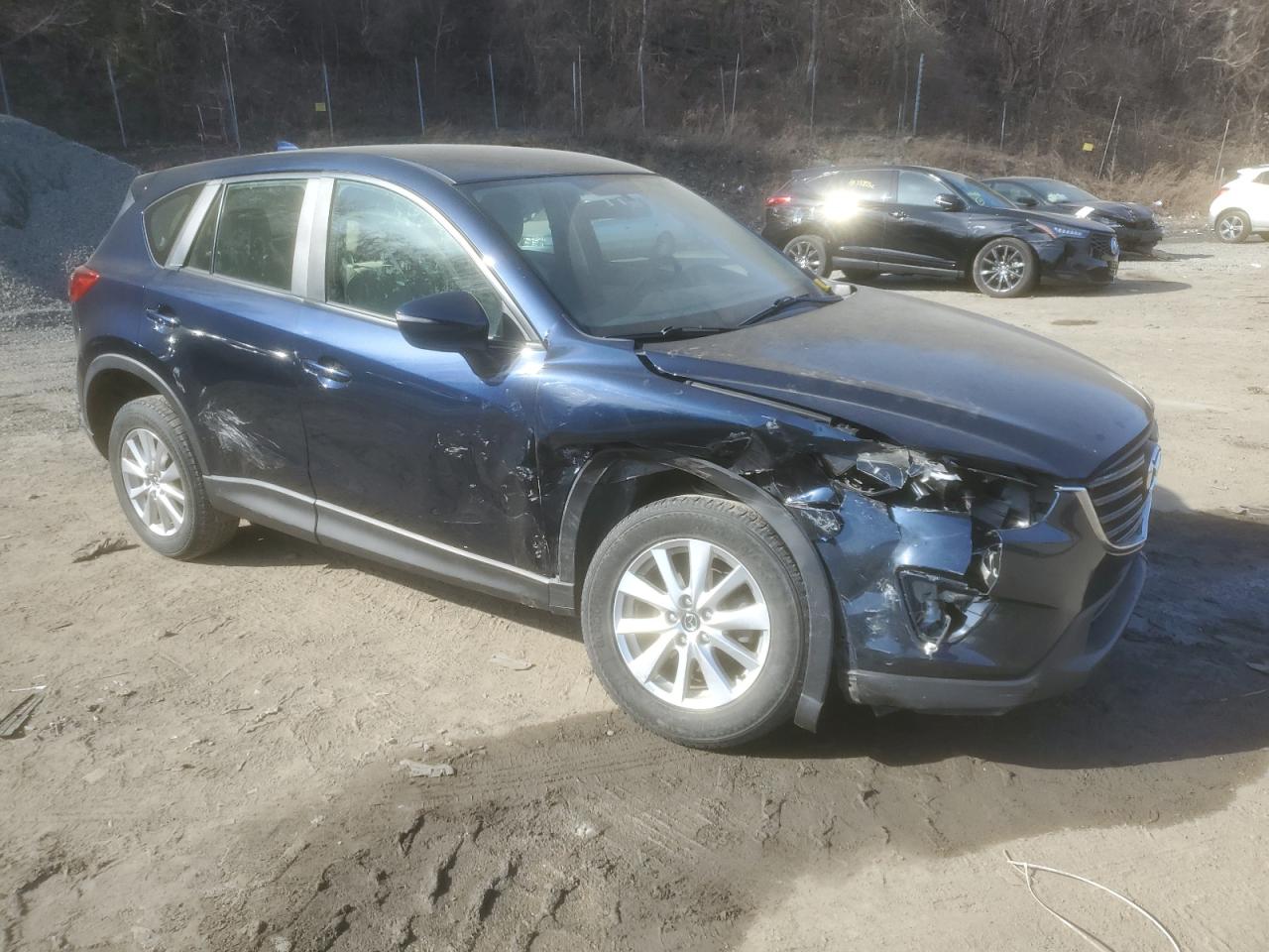 2016 Mazda CX-5 VIN JM3KE4BY8G0902921 Copart auction photo, front end / side damage thumbnail 4
