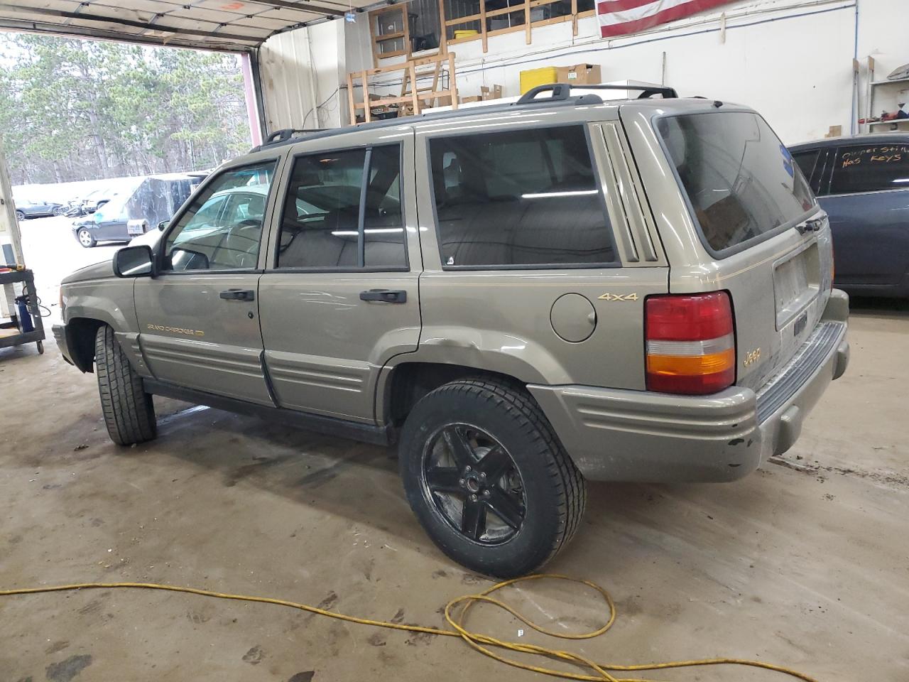 1996 Jeep Grand Cherokee VIN 1J4GZ78S5TC210710 Copart auction photo, front end / rear end damage thumbnail 2