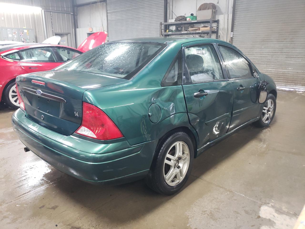 2000 Ford Focus VIN 1FAFP3432YW312878 Copart auction photo, side / rear end damage thumbnail 3