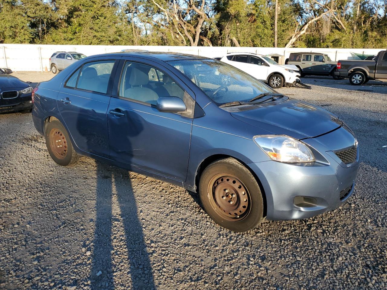 2012 Toyota Yaris VIN JTDBT4K31C1415387 Copart auction photo, all over damage thumbnail 4