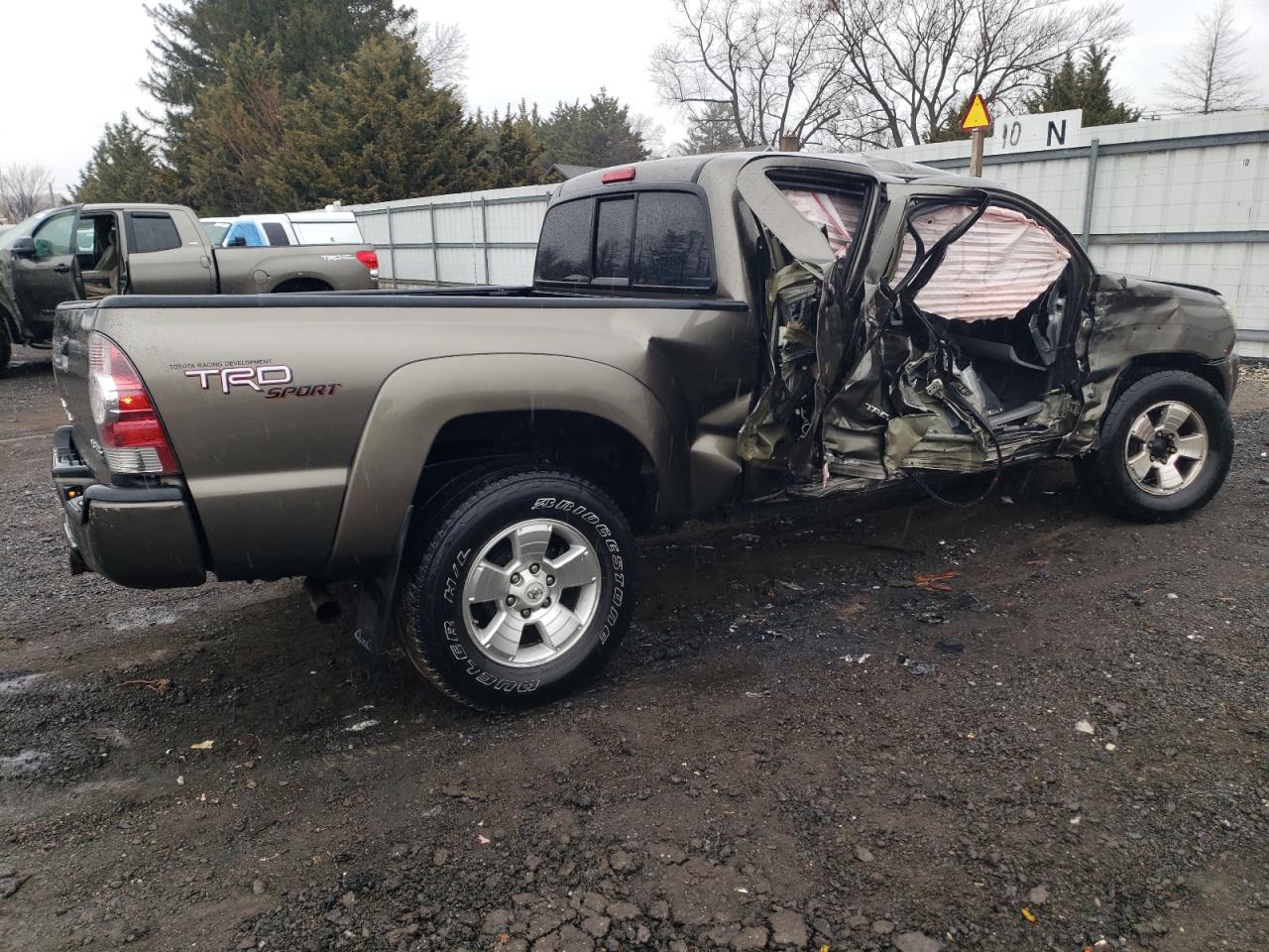 2010 Toyota Tacoma VIN 3TMMU4FNXAM021159 Copart auction photo, side / all over damage thumbnail 3