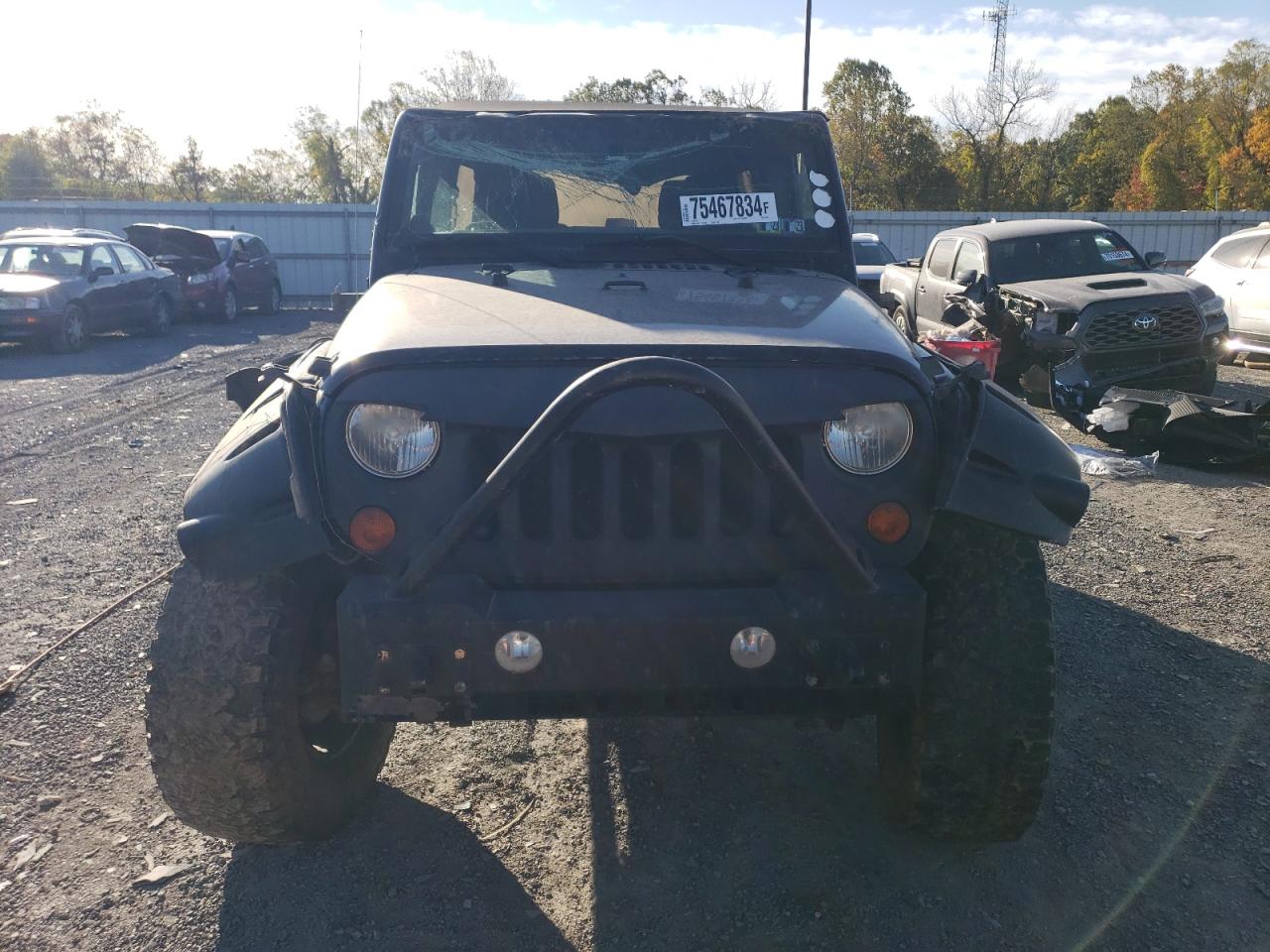 2012 Jeep Wrangler VIN 1C4BJWDG9CL287387 Copart auction photo, front end / side damage thumbnail 5