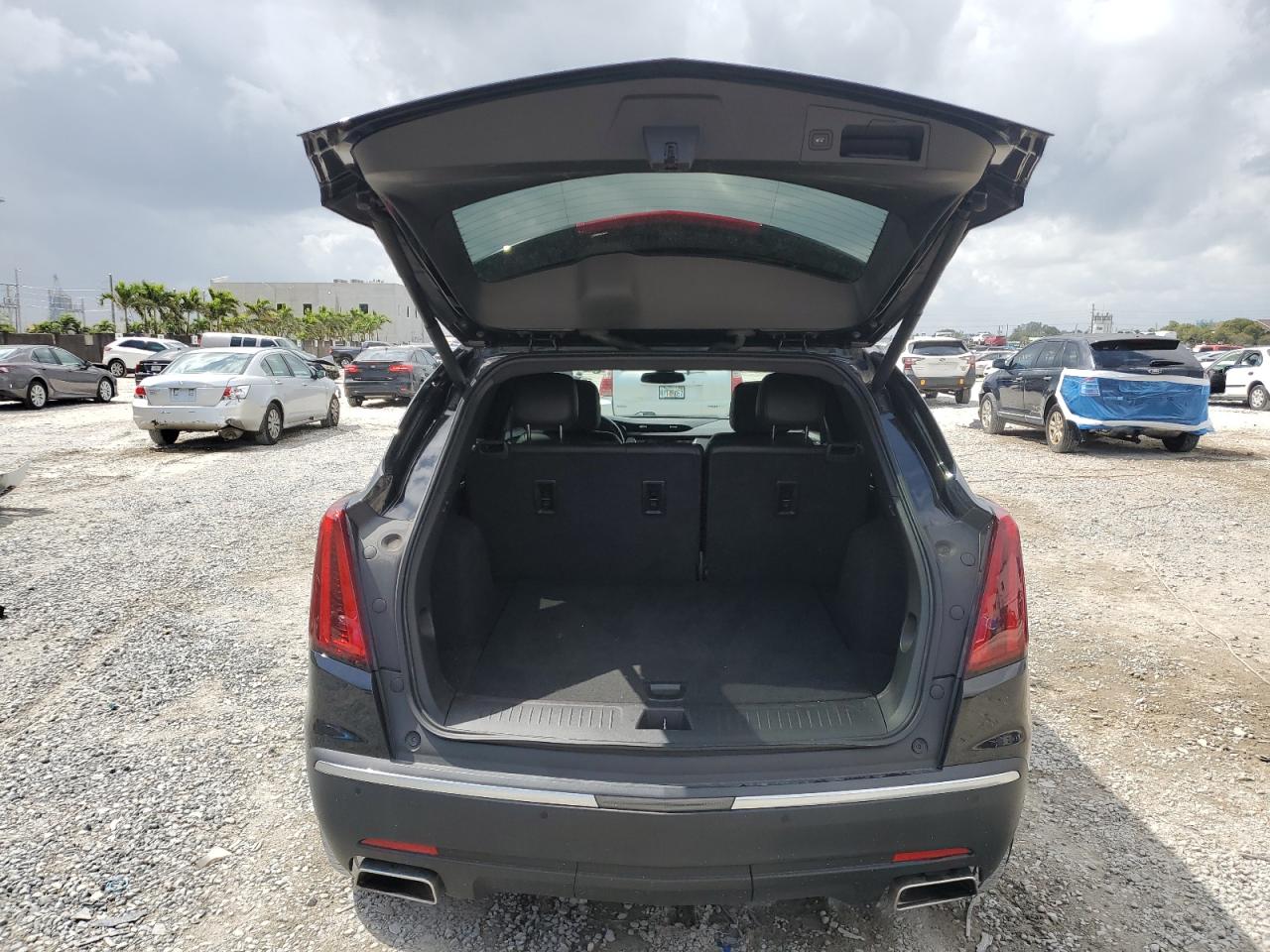 2021 Cadillac XT5 VIN 1GYKNAR46MZ127028 Copart auction photo, front end / side damage thumbnail 6