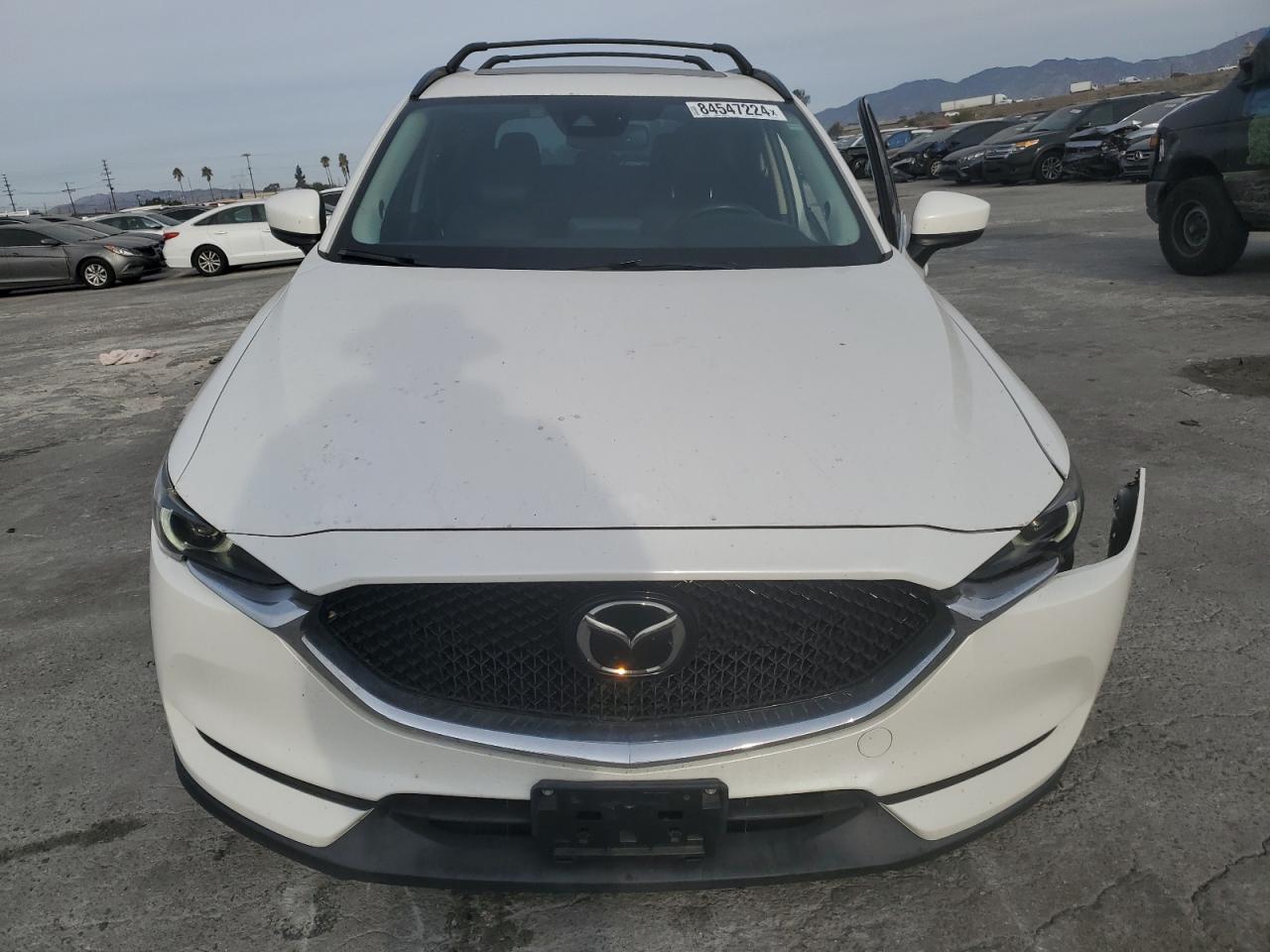 2017 Mazda CX-5 VIN JM3KFADL2H0131984 Copart auction photo, undercarriage / all over damage thumbnail 5
