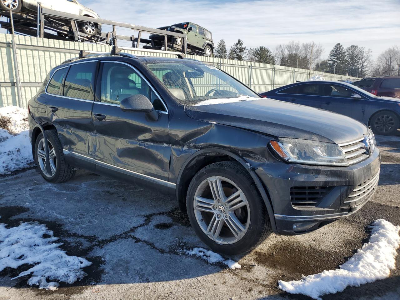 2016 Volkswagen Touareg VIN WVGEF9BP8GD000653 Copart auction photo, side / front end damage thumbnail 4