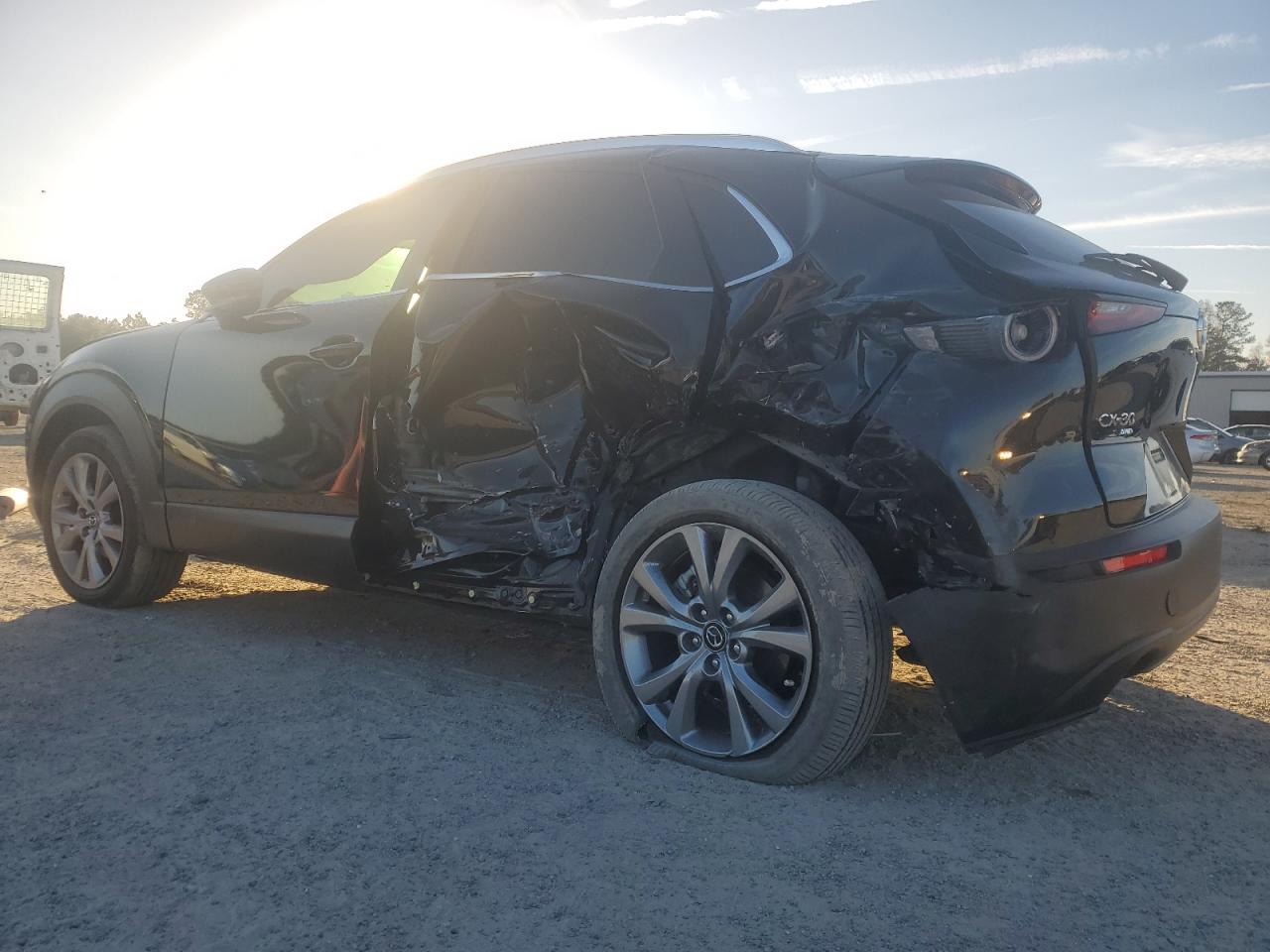2023 Mazda CX-30 VIN 3MVDMBBM0PM569695 Copart auction photo, side / rear end damage thumbnail 2