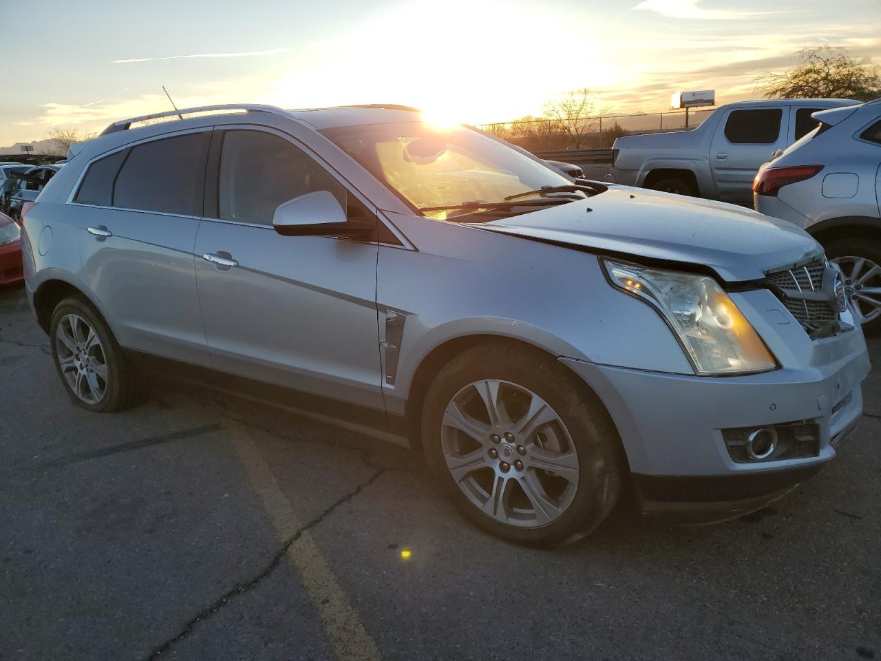 2012 Cadillac SRX VIN 3GYFNCE34CS516143 Copart auction photo, front end damage thumbnail 4