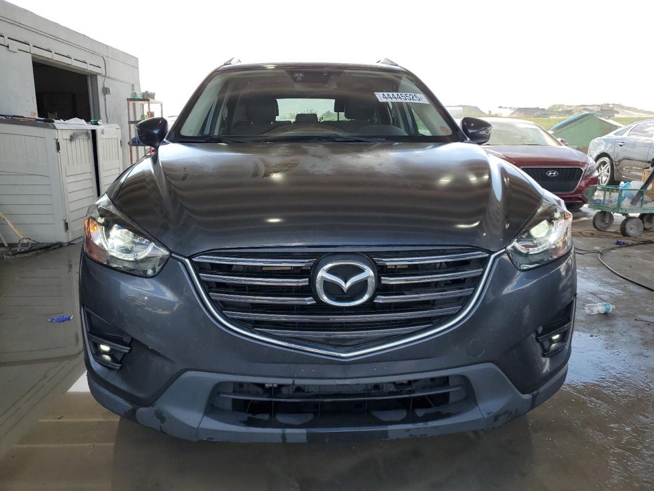 2016 Mazda CX-5 VIN JM3KE4DY4G0616206 Copart auction photo, rear end / minor dent/scratches damage thumbnail 5
