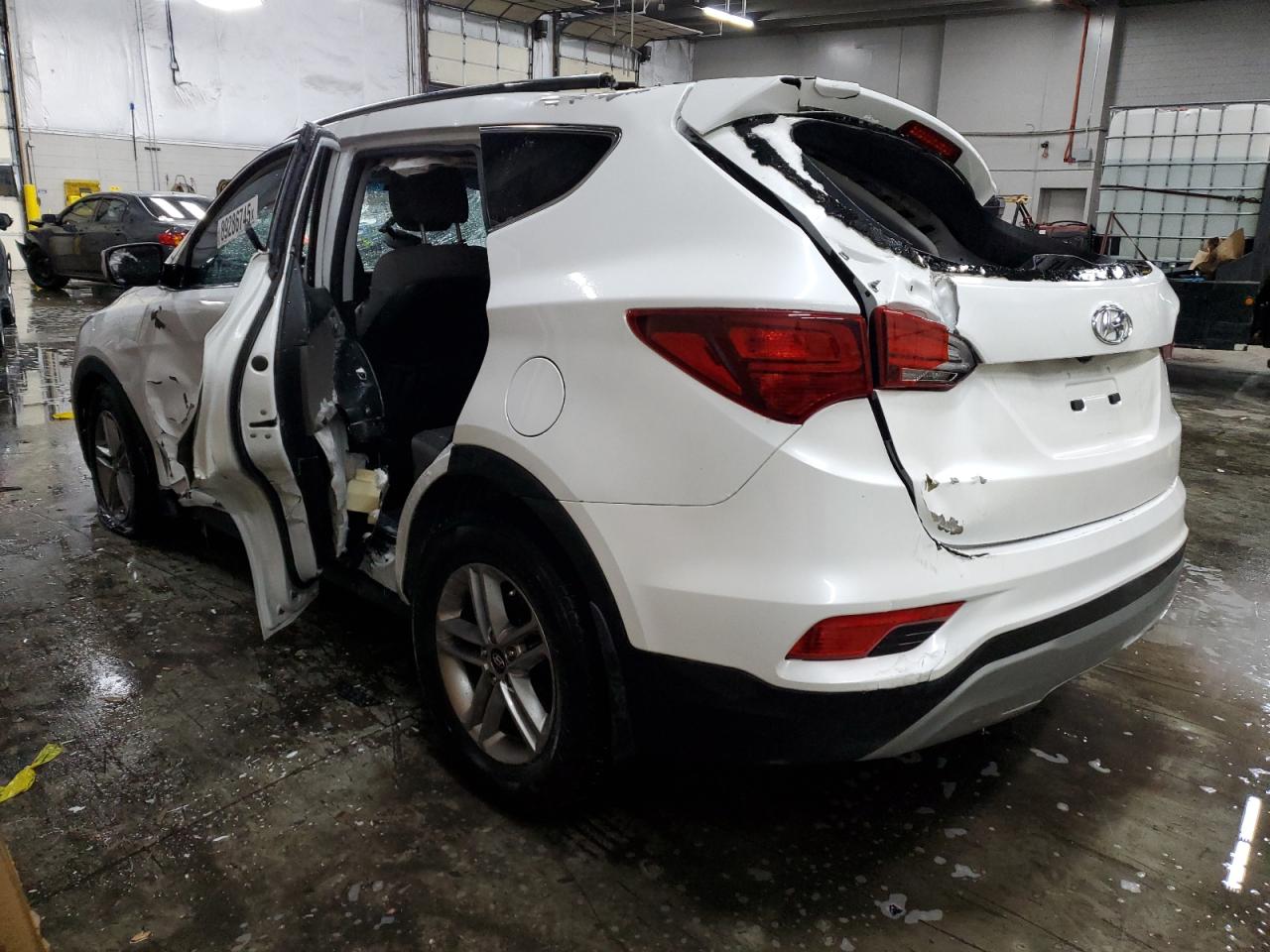 2018 Hyundai Santa Fe VIN 5NMZUDLB7JH053862 Copart auction photo, rollover damage thumbnail 2