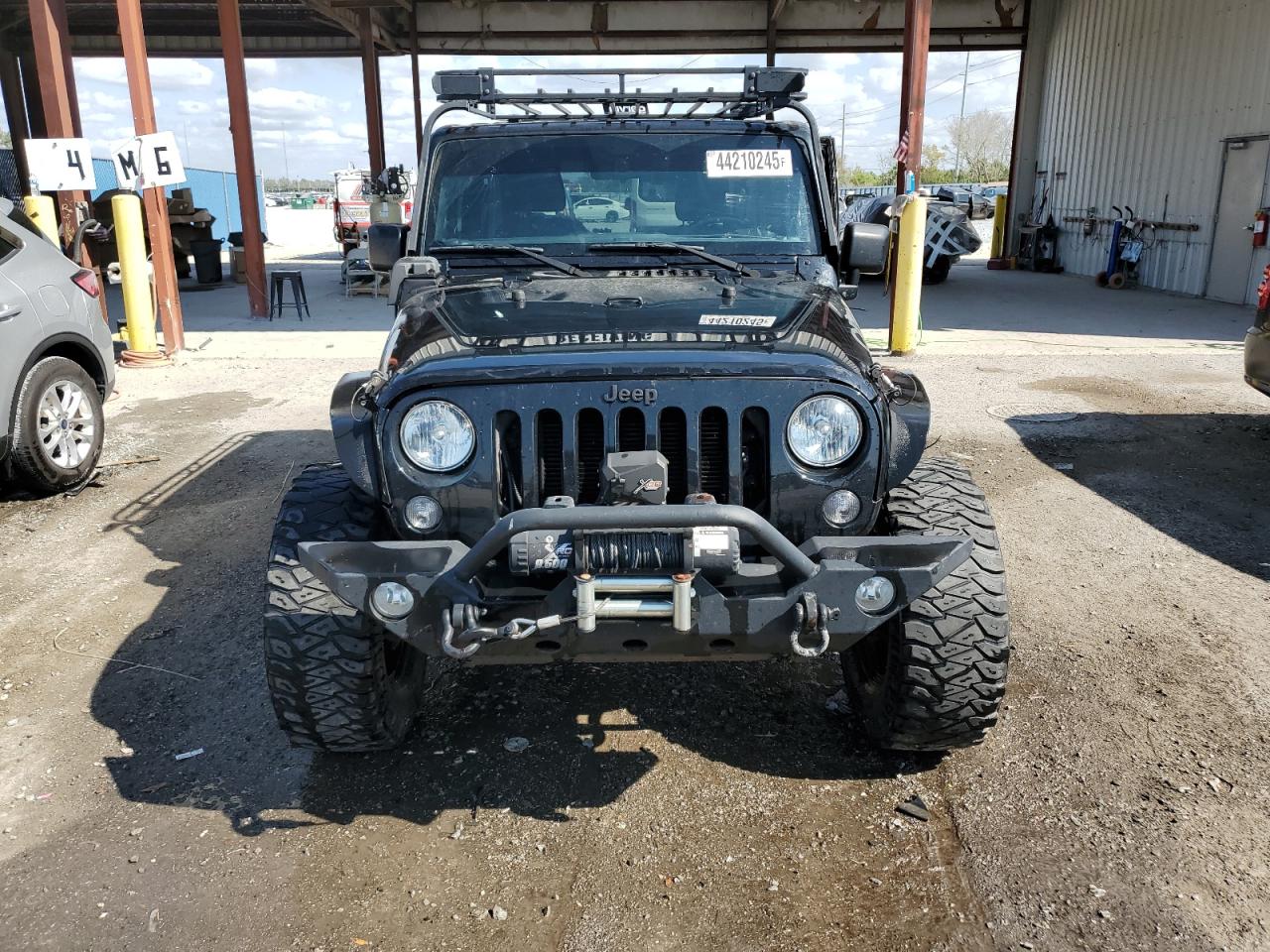 2016 Jeep Wrangler VIN 1C4AJWAG0GL110748 Copart auction photo, side damage thumbnail 5