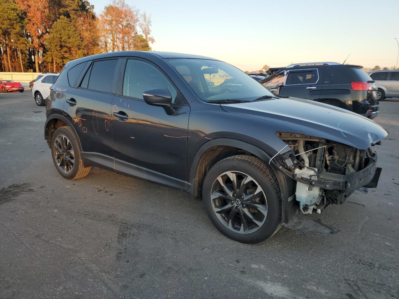 2016 Mazda CX-5 VIN JM3KE2DY2G0696318 Copart auction photo, rear end / front end damage thumbnail 4