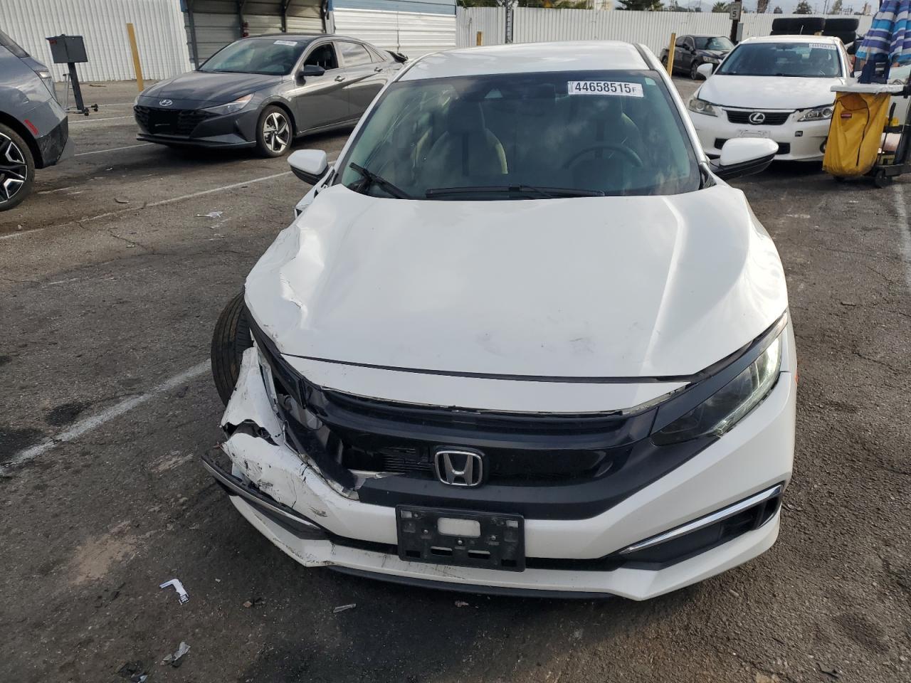 2020 Honda Civic VIN 19XFC2F65LE201736 Copart auction photo, undercarriage / all over damage thumbnail 5