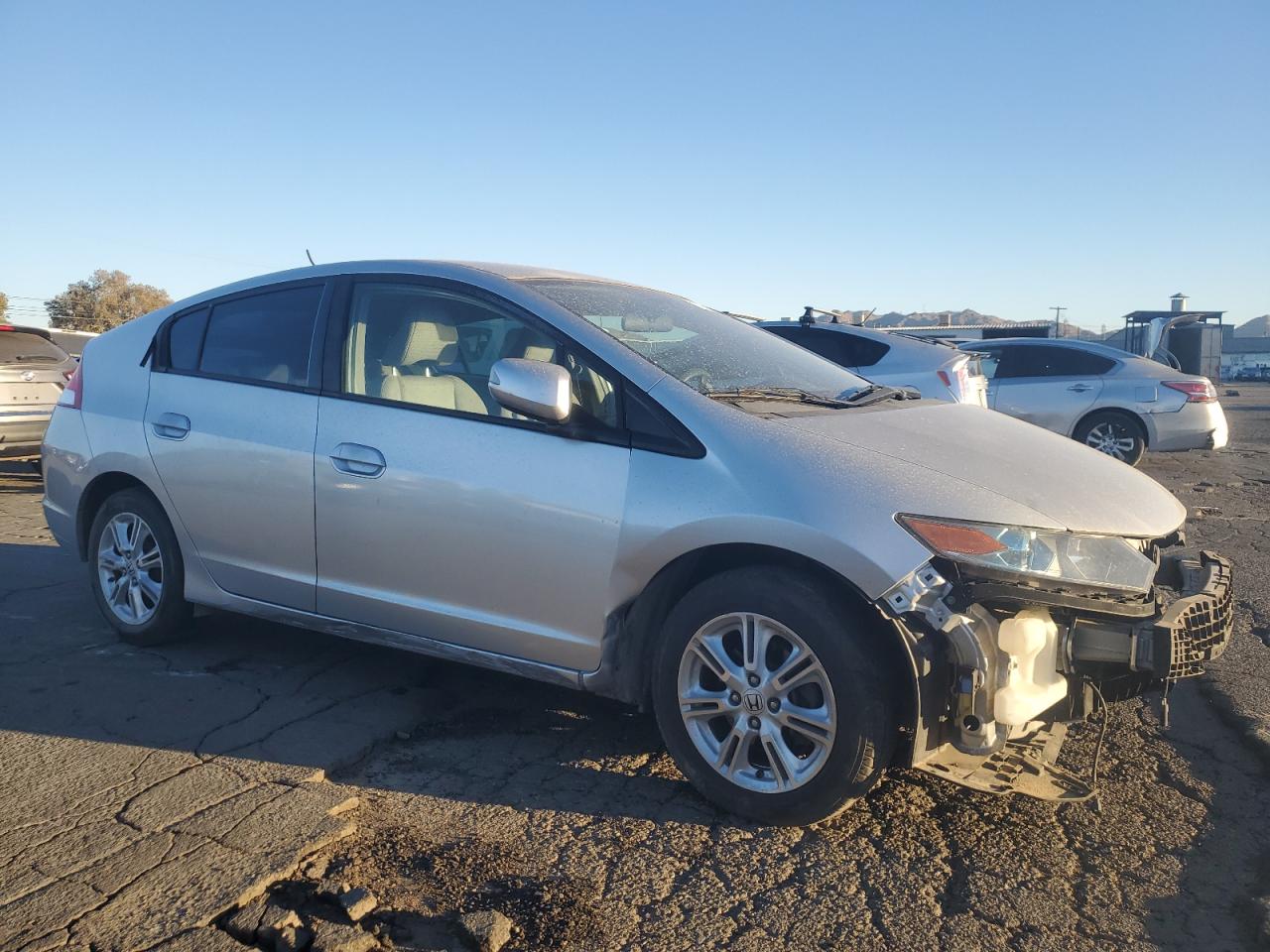 2010 Honda Insight VIN JHMZE2H7XAS022338 Copart auction photo, front end / side damage thumbnail 4