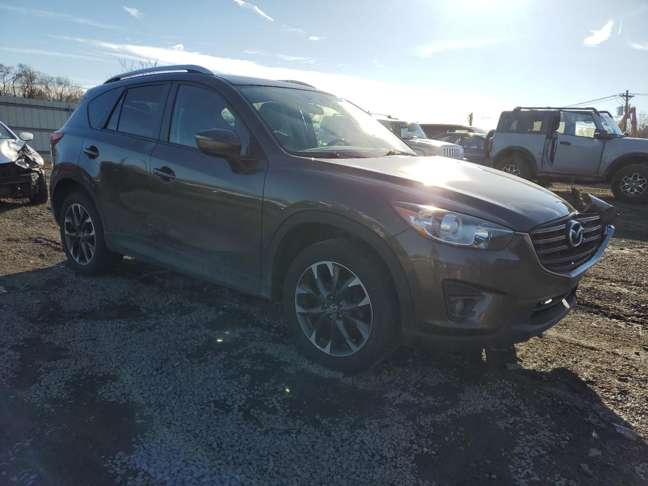 2016 Mazda CX-5 VIN JM3KE4DY0G0830996 Copart auction photo, front end / side damage thumbnail 4
