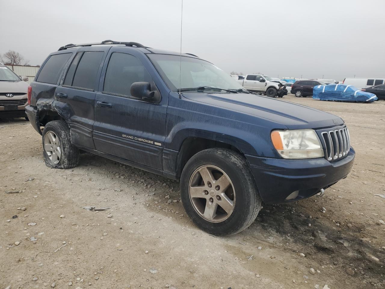 2001 Jeep Grand Cherokee VIN 1J4GW58N31C713124 Copart auction photo, side / rear end damage thumbnail 4