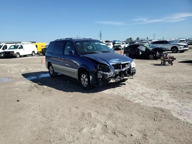 2003 KIA Sedona VIN KNDUP131736409797 Copart auction photo, front end / minor dent/scratches damage thumbnail 12