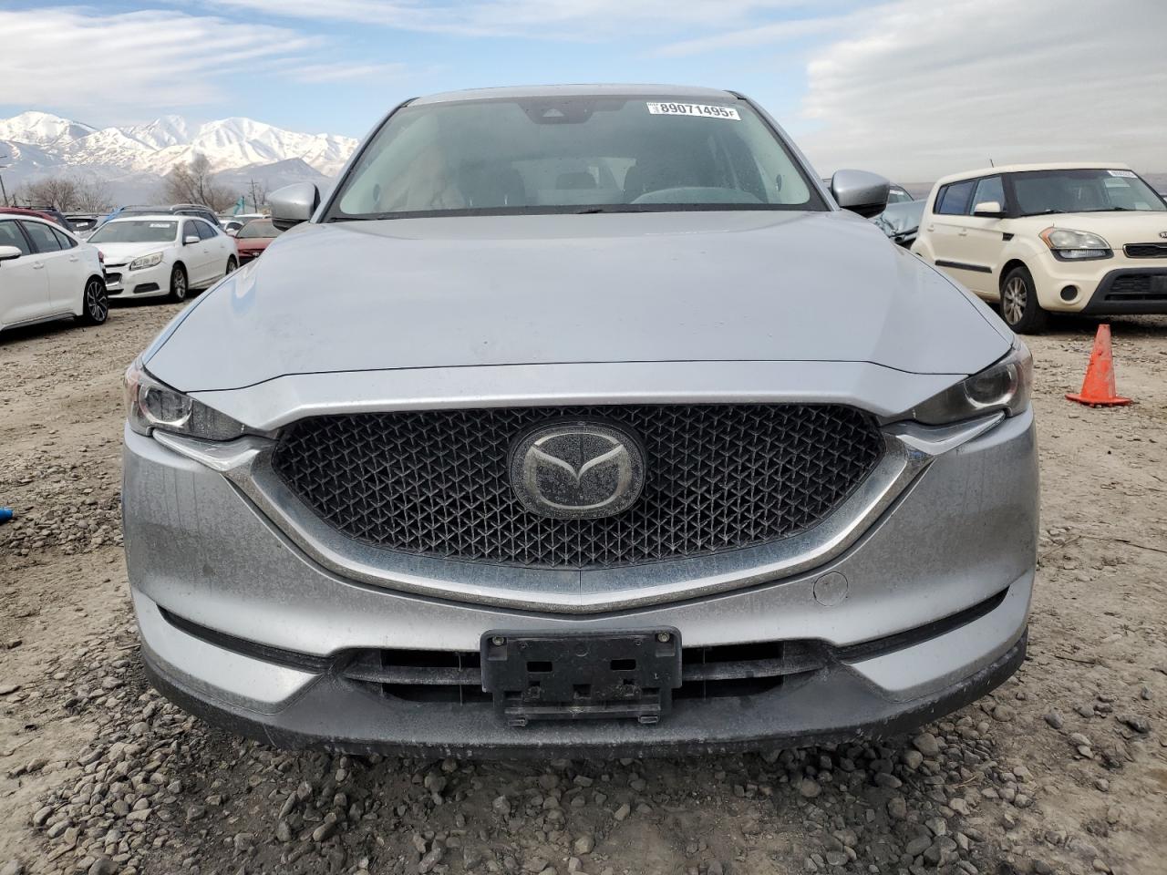 2021 Mazda CX-5 VIN JM3KFACM9M0409414 Copart auction photo, side damage thumbnail 5