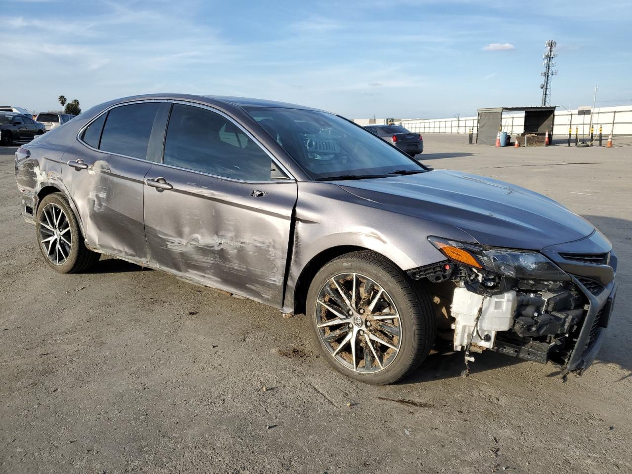 2022 Toyota Camry VIN 4T1T11AK1NU063801 Copart auction photo, all over damage thumbnail 4