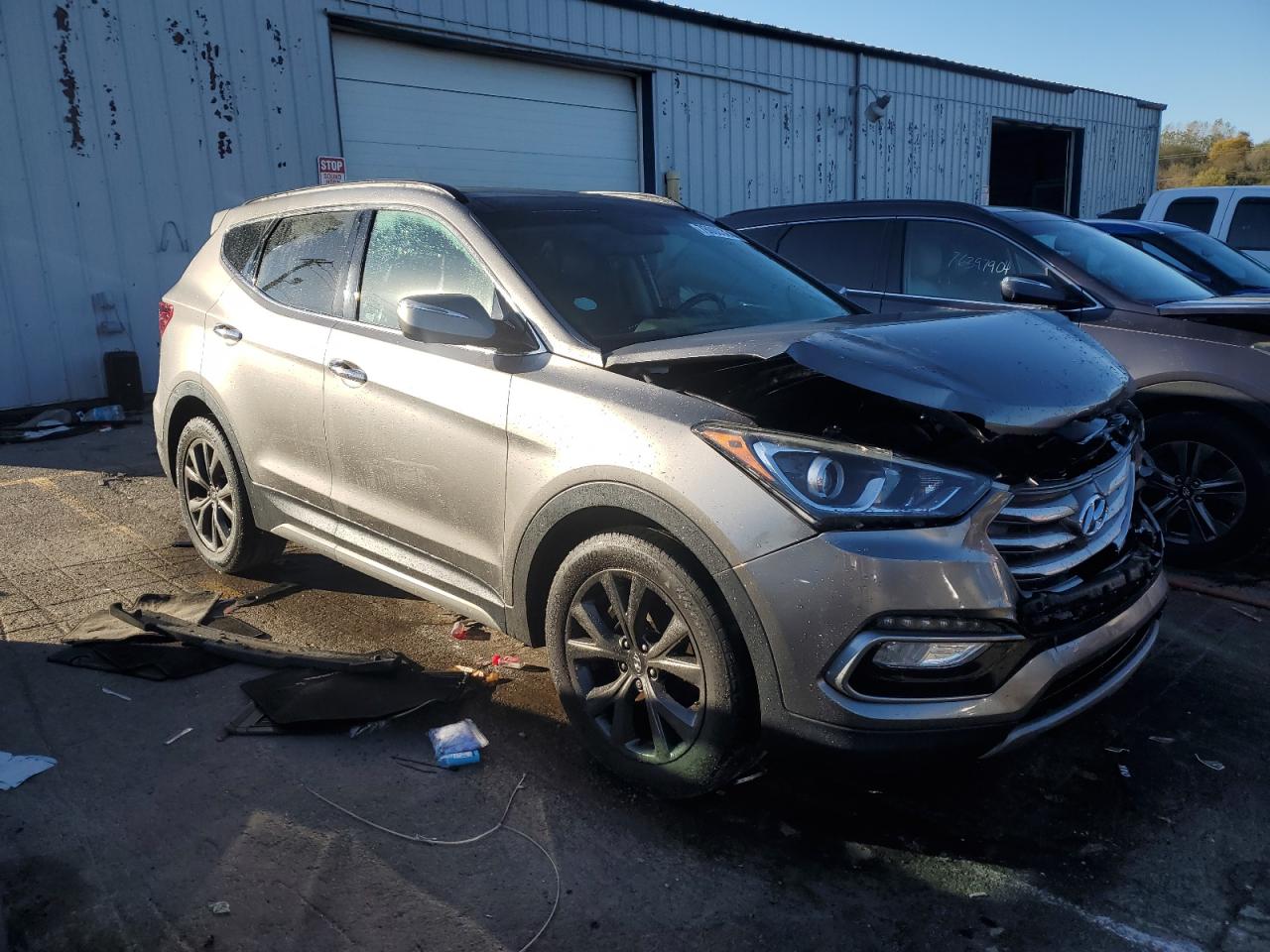 2018 Hyundai Santa Fe VIN 5NMZWDLA5JH055921 Copart auction photo, front end damage thumbnail 4