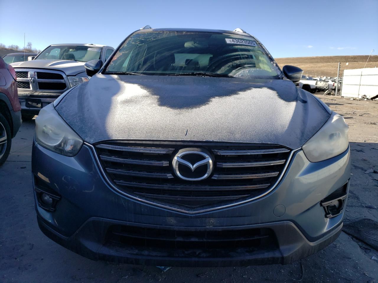 2016 Mazda CX-5 VIN JM3KE4CY2G0626993 Copart auction photo, rear end / hail damage thumbnail 5