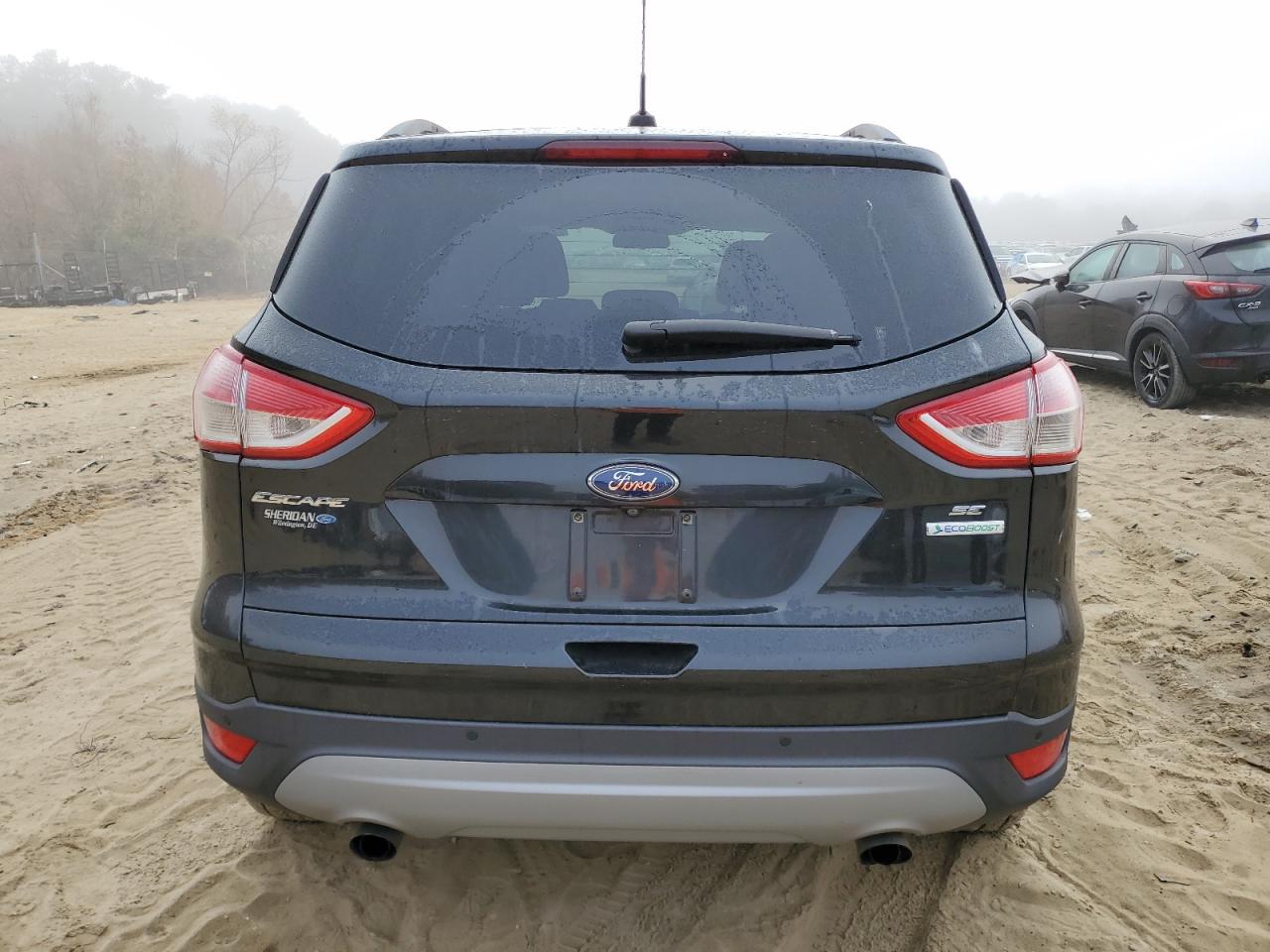 2014 Ford Escape VIN 1FMCU0GX2EUC97482 Copart auction photo, side / minor dent/scratches damage thumbnail 6