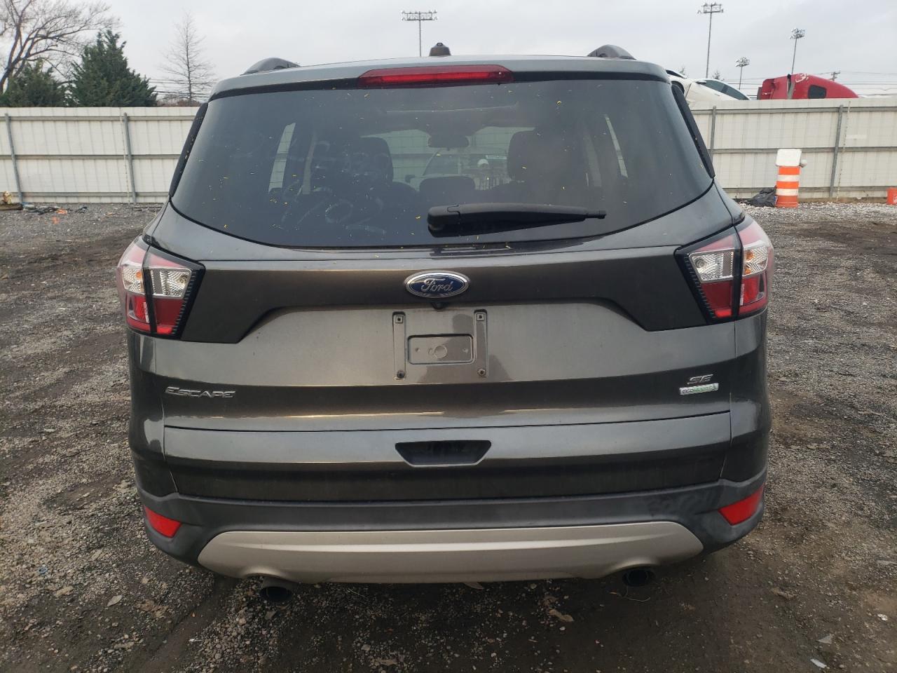 2018 Ford Escape VIN 1FMCU0GD7JUB62045 Copart auction photo, vandalism / minor dent/scratches damage thumbnail 6