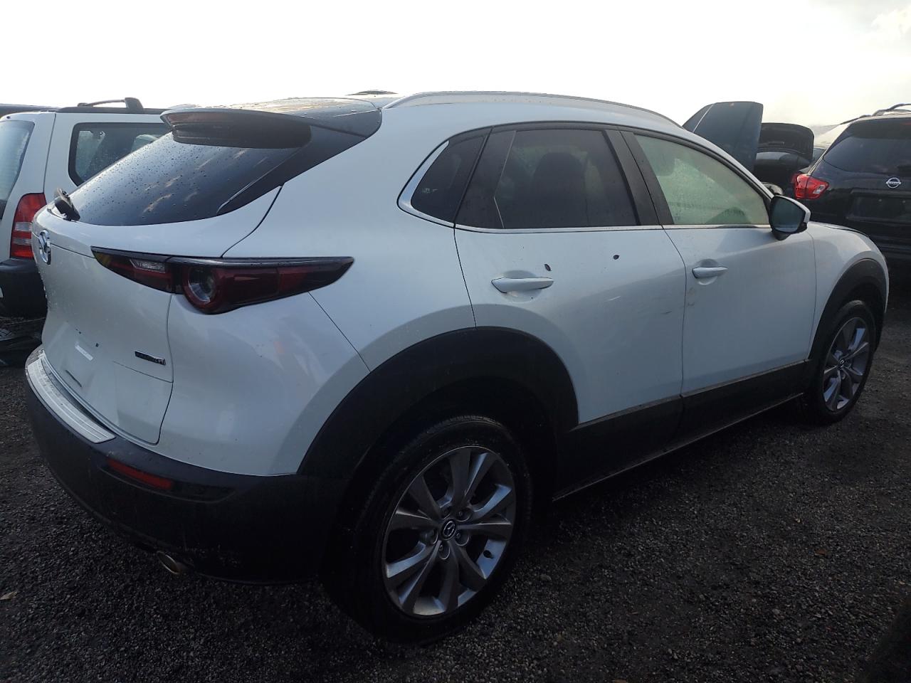 2023 Mazda CX-30 VIN 3MVDMBBM4PM545982 Copart auction photo, water/flood damage thumbnail 3
