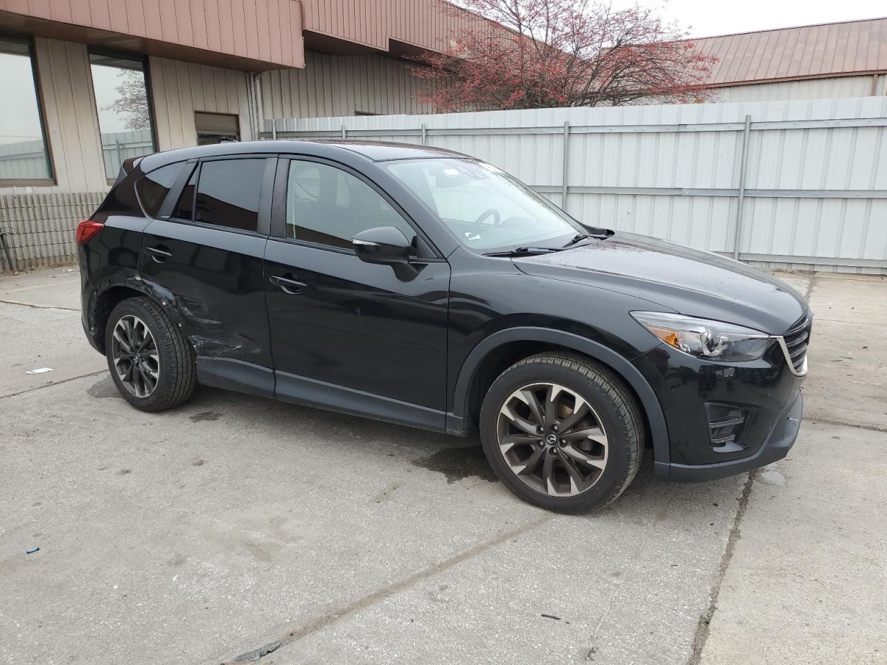 2016 Mazda CX-5 VIN JM3KE4DYXG0701969 Copart auction photo, side / rear end damage thumbnail 4