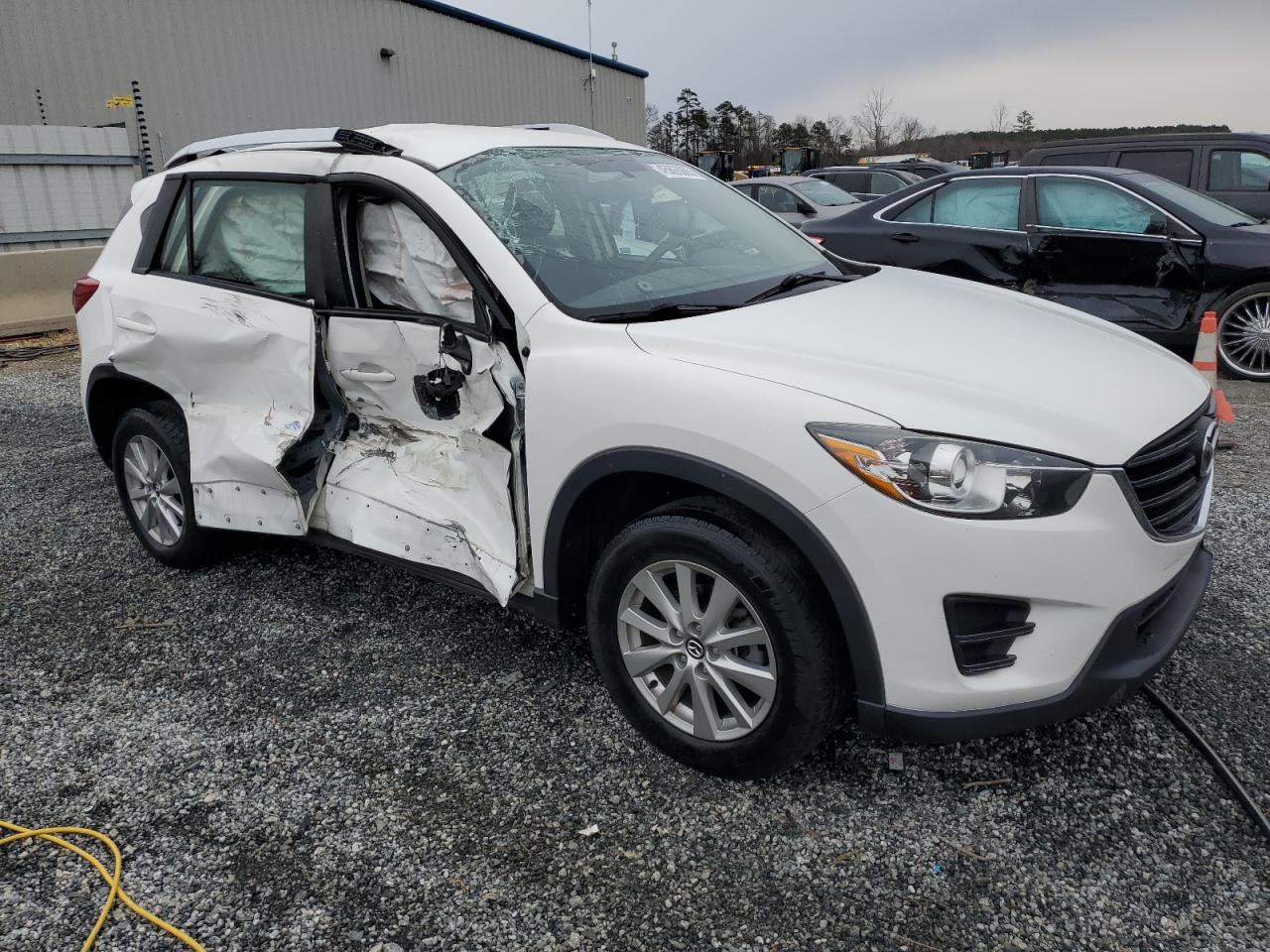 2016 Mazda CX-5 VIN JM3KE4BY2G0609130 Copart auction photo, side damage thumbnail 4