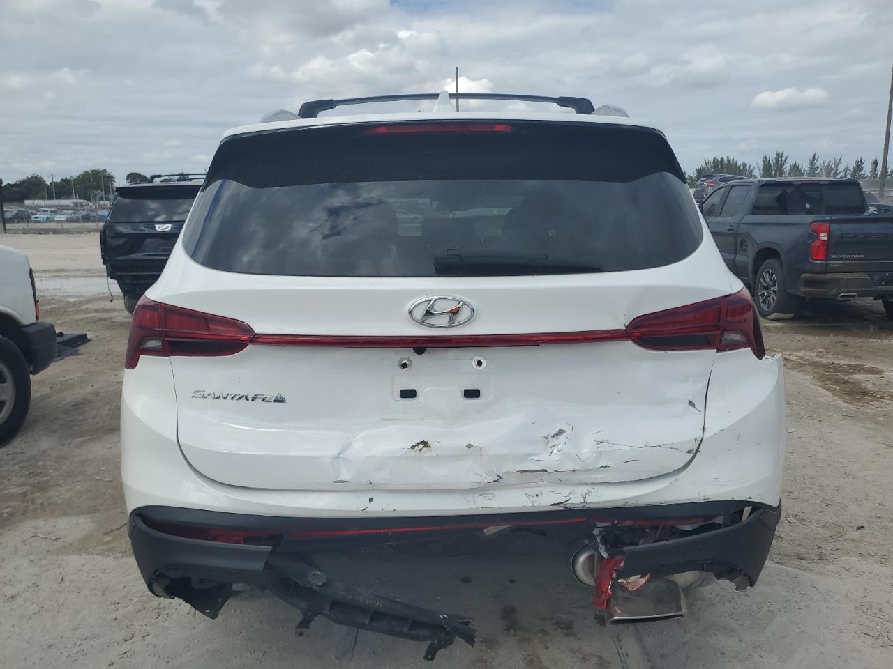 2023 Hyundai Santa Fe VIN 5NMS24AJ6PH641424 Copart auction photo, rear end / minor dent/scratches damage thumbnail 6