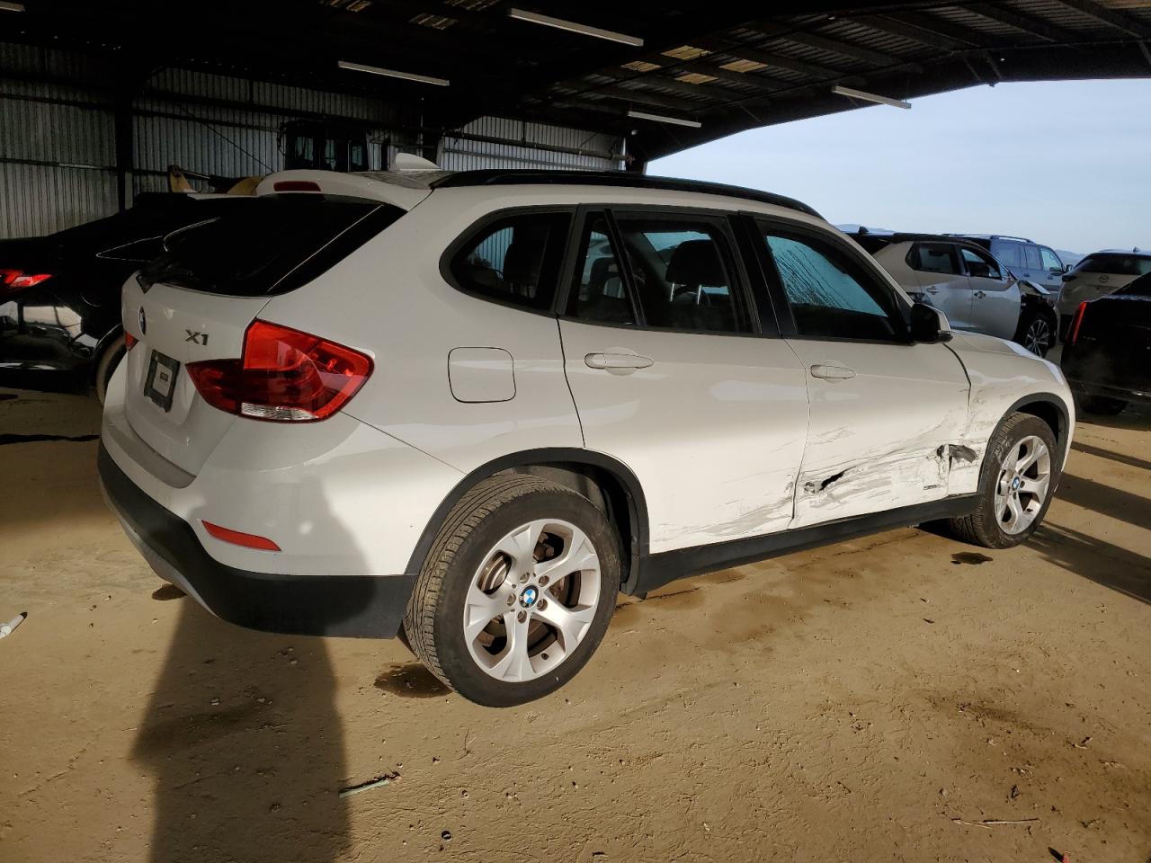 2015 BMW X1 VIN WBAVM1C50FVW58031 Copart auction photo, side / front end damage thumbnail 3