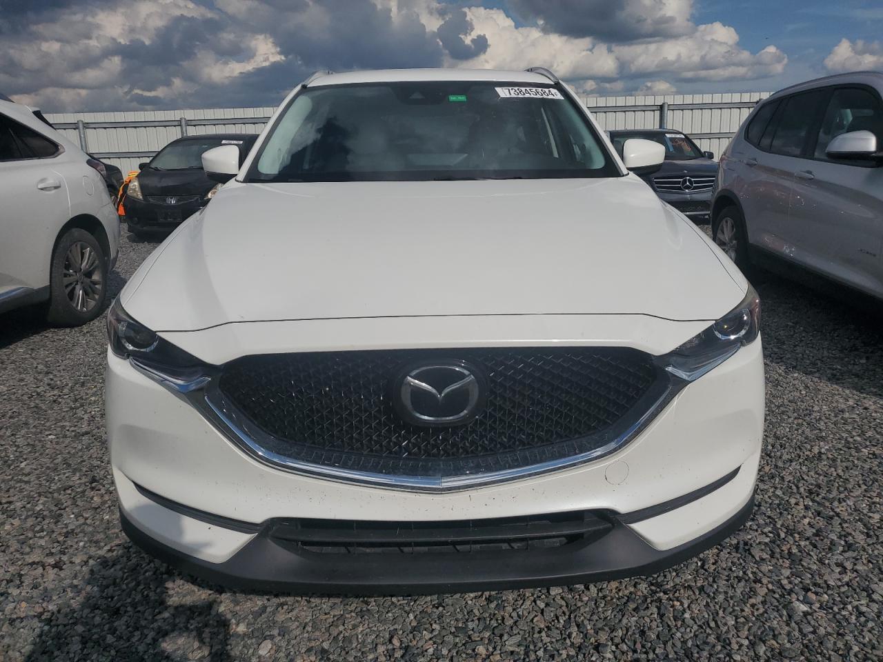 2021 Mazda CX-5 VIN JM3KFACM9M0304873 Copart auction photo, water/flood damage thumbnail 5