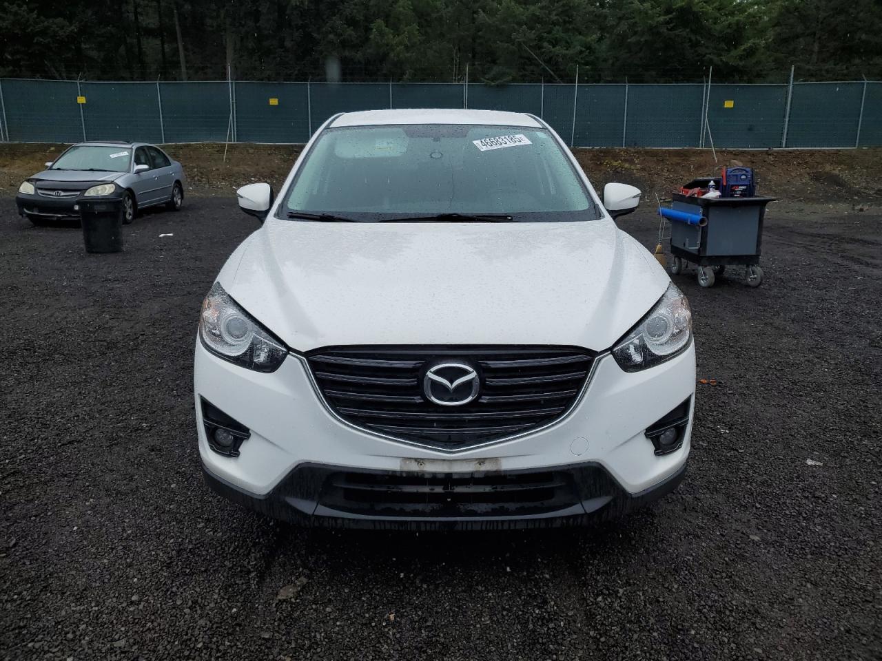 2016 Mazda CX-5 VIN JM3KE4CY3G0909919 Copart auction photo, rear end damage thumbnail 5