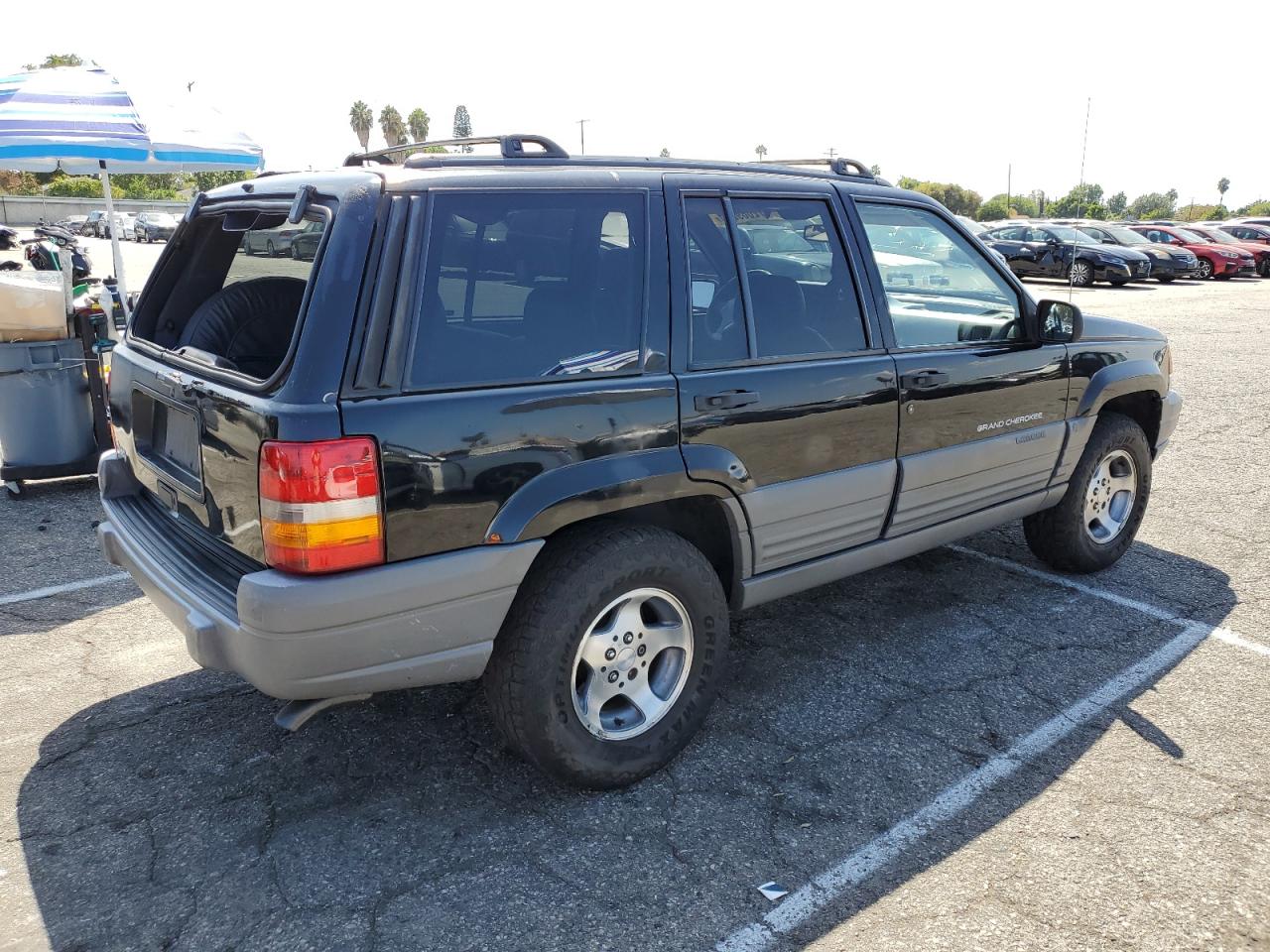 1998 Jeep Grand Cherokee VIN 1J4FX58S3WC144586 Copart auction photo, side / minor dent/scratches damage thumbnail 3