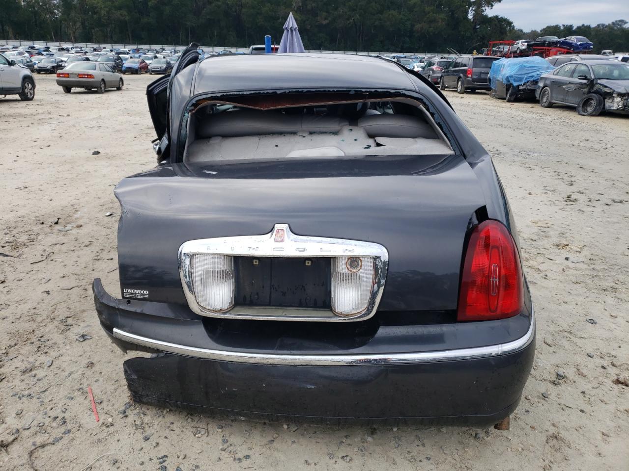 2002 Lincoln Town Car VIN 1LNHM81WX2Y645781 Copart auction photo, all over damage thumbnail 6