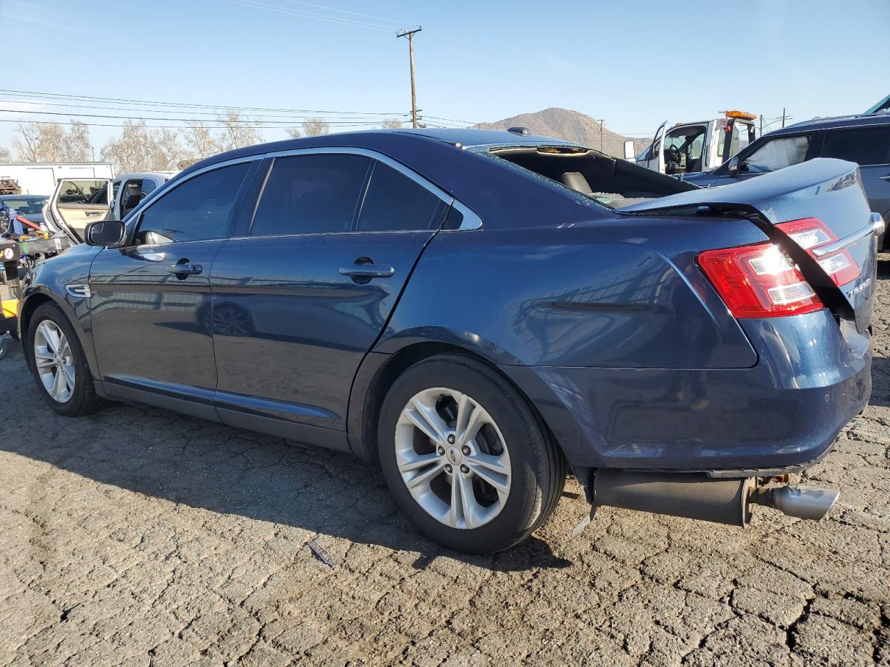 2016 Ford Taurus VIN 1FAHP2E82GG122407 Copart auction photo, rear end damage thumbnail 2