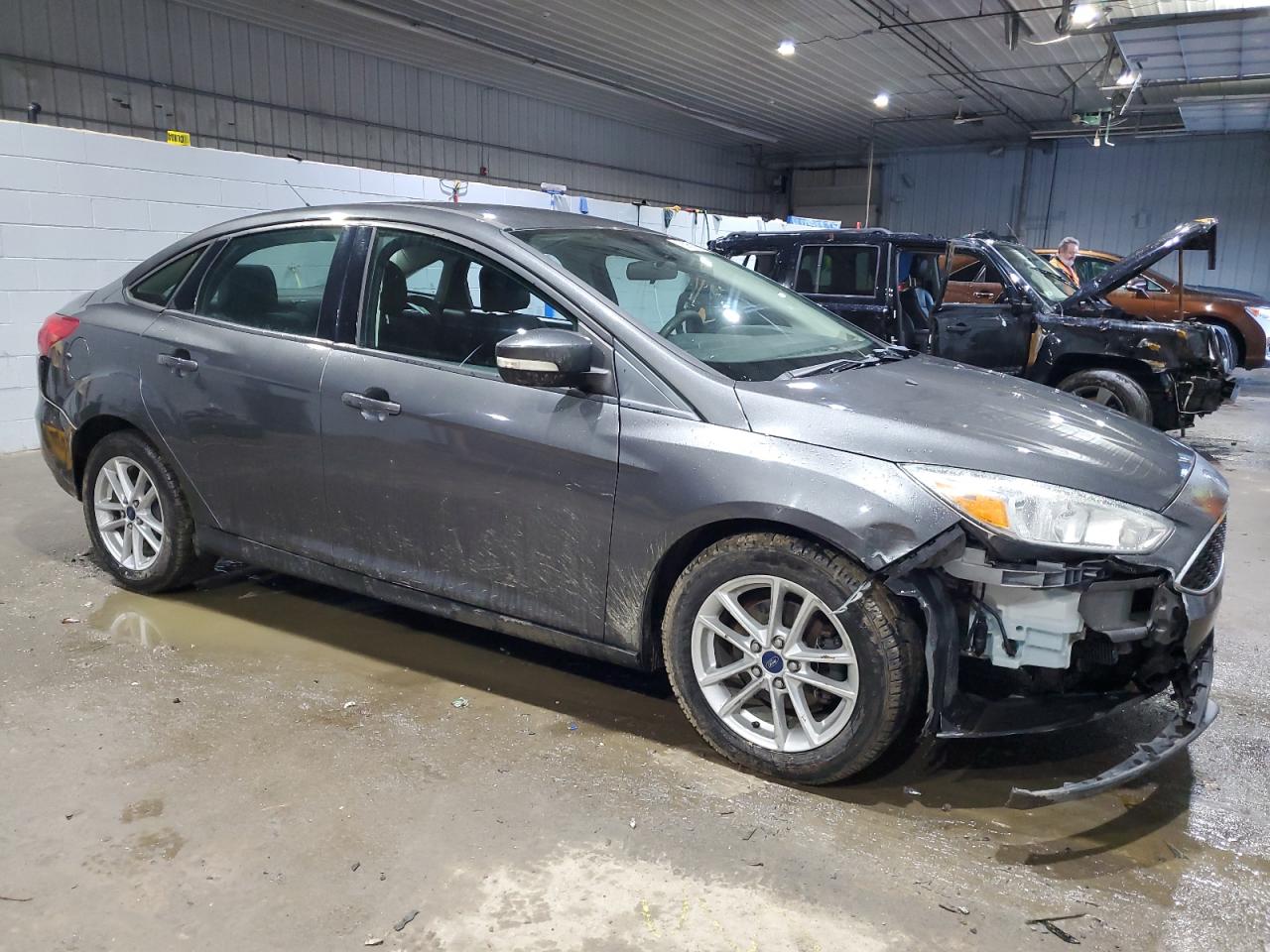 2015 Ford Focus VIN 1FADP3F28FL234004 Copart auction photo, all over damage thumbnail 4