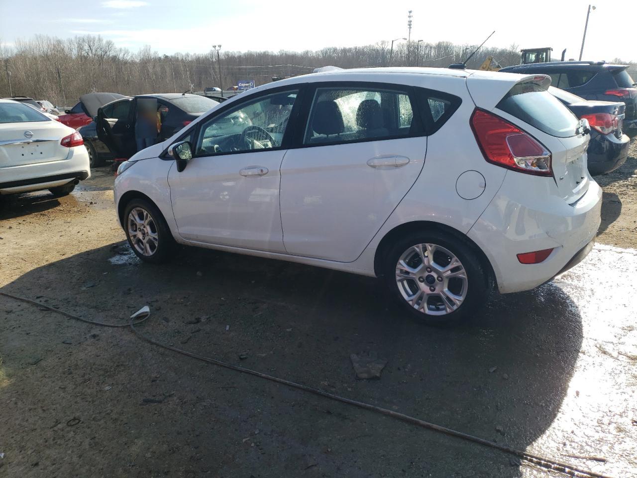 2015 Ford Fiesta VIN 3FADP4EJXFM204256 Copart auction photo, rear end damage thumbnail 2