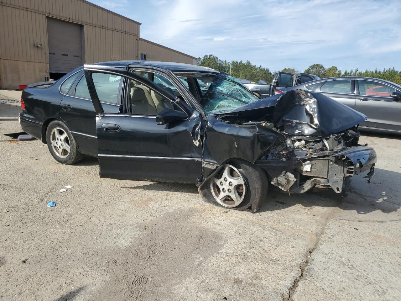 1999 Toyota Avalon VIN 4T1BF18B3XU296293 Copart auction photo, all over damage thumbnail 4