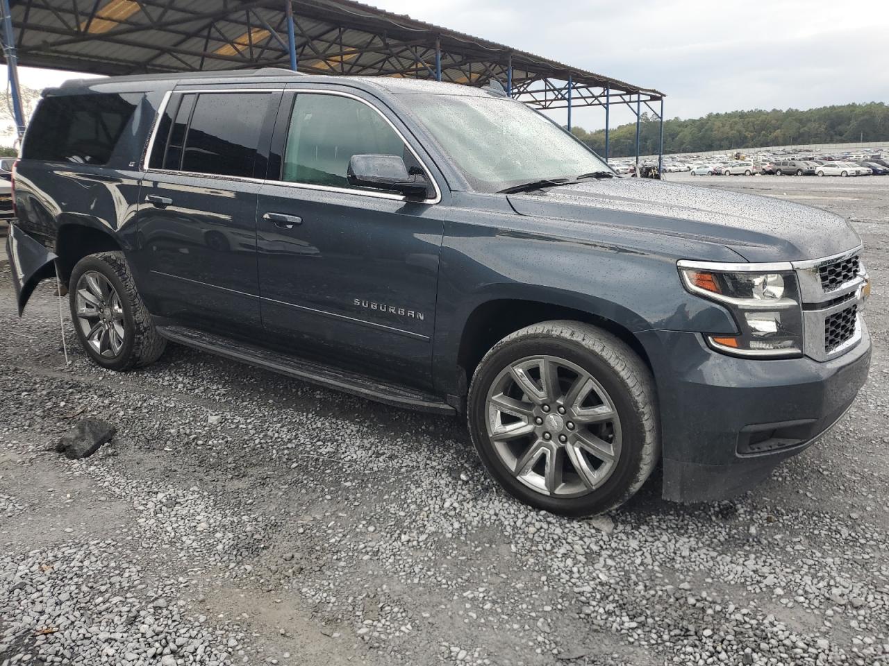 2019 Chevrolet Suburban VIN 1GNSCHKCXKR148975 Copart auction photo, rear end / side damage thumbnail 4