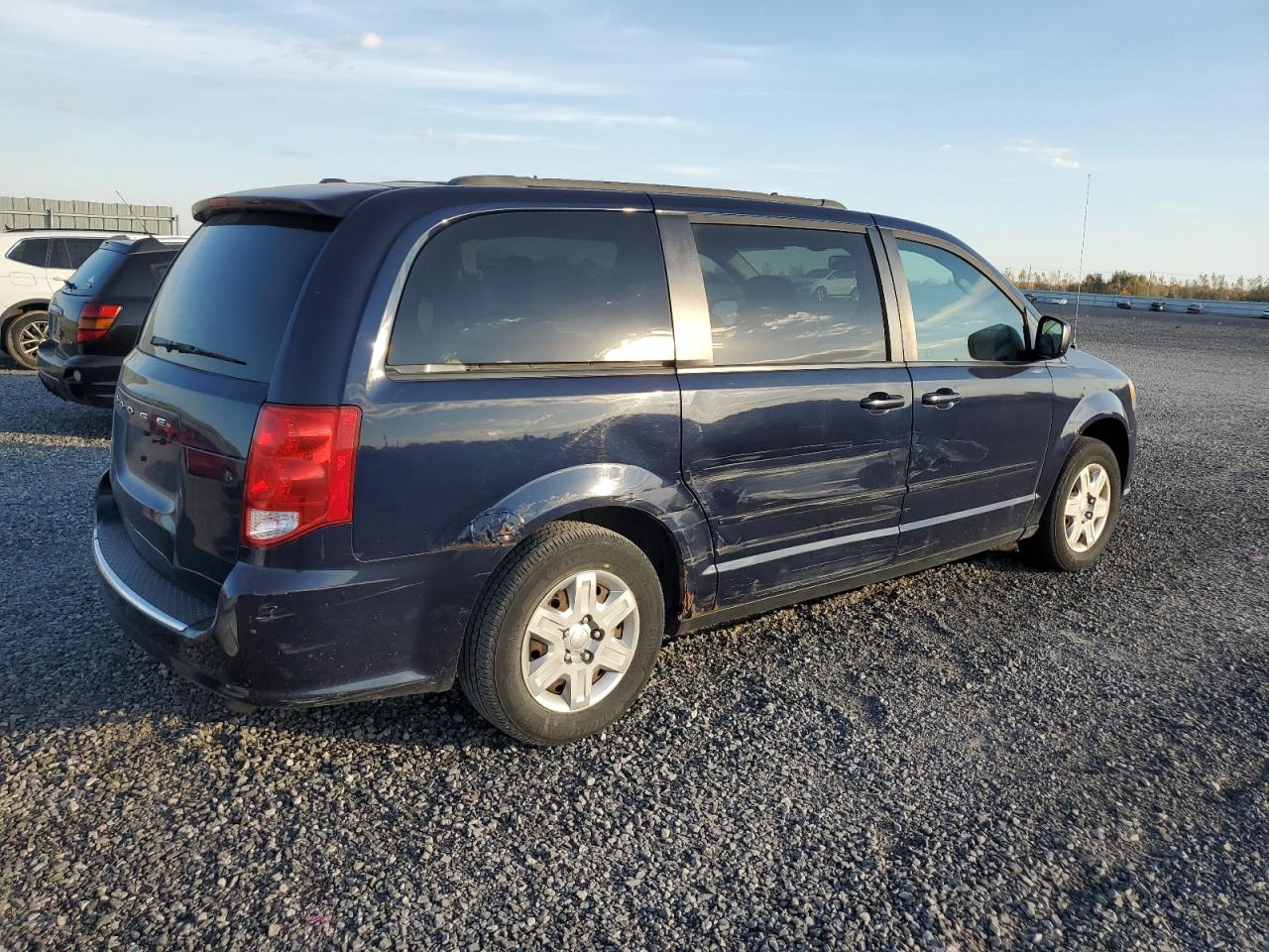 2012 Dodge Caravan VIN 2C4RDGBG1CR311235 Copart auction photo, side / minor dent/scratches damage thumbnail 3