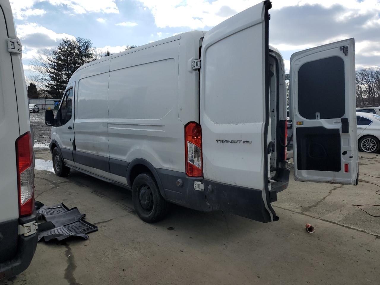 2015 Ford Transit VIN 1FTCR2CMXFKA93247 Copart auction photo, normal wear / minor dent/scratches damage thumbnail 2