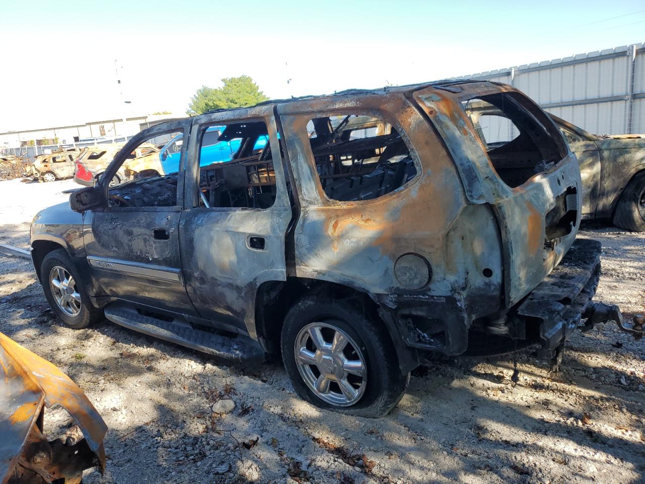 2004 GMC Envoy VIN 1GKDT13S342132387 Copart auction photo, burn damage thumbnail 2