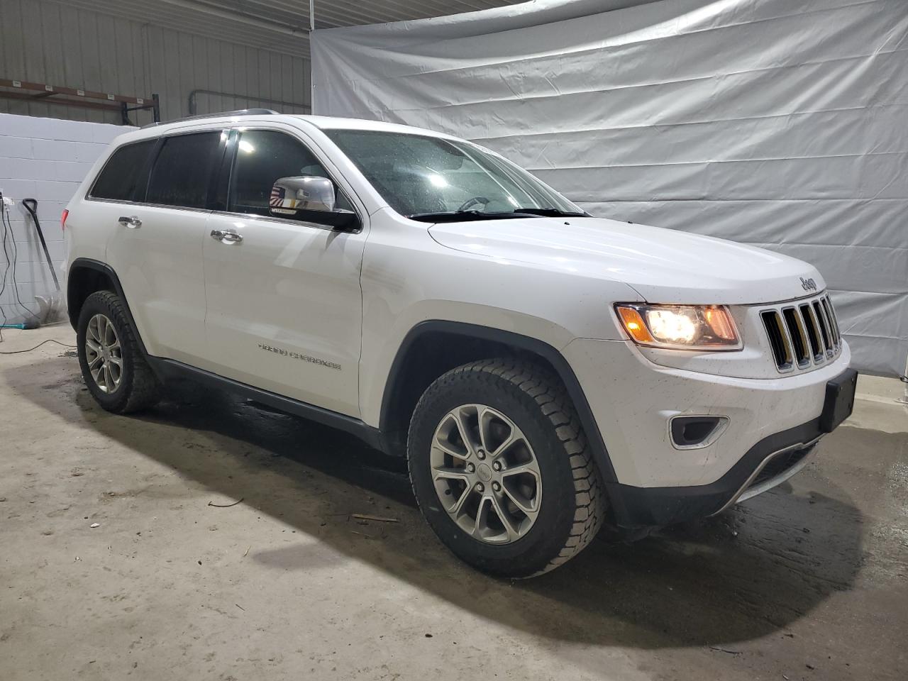 2015 Jeep Grand Cherokee VIN 1C4RJFBGXFC189409 Copart auction photo, front end / minor dent/scratches damage thumbnail 4