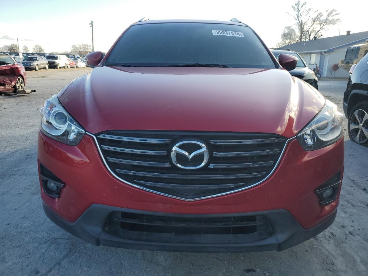 2016 Mazda CX-5 VIN JM3KE4CY6G0808518 Copart auction photo, burn damage thumbnail 5