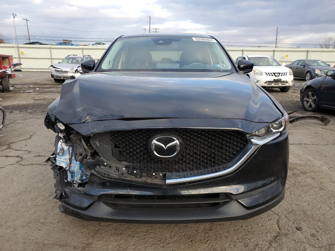 2021 Mazda CX-5 VIN JM3KFBCM5M1337255 Copart auction photo, front end / side damage thumbnail 5