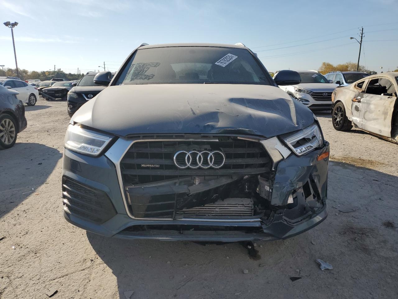 2018 Audi Q3 VIN WA1JCCFS0JR024747 Copart auction photo, front end / minor dent/scratches damage thumbnail 5