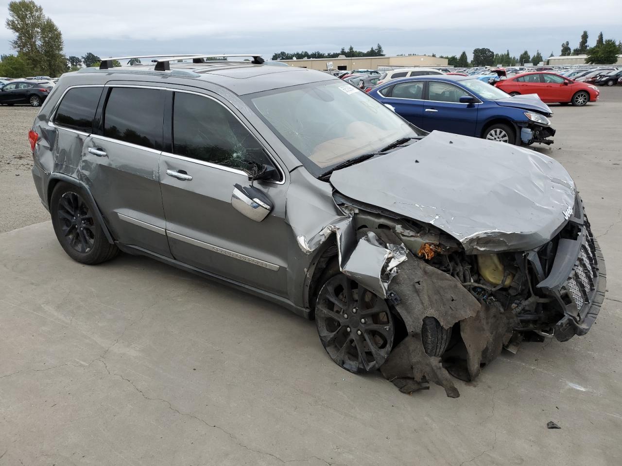 2012 Jeep Grand Cherokee VIN 1C4RJFCT7CC240632 Copart auction photo, front end / side damage thumbnail 4